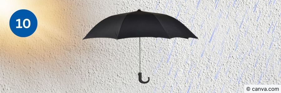 Schwarzer Regenschirm symbolisiert Wetterschutz der Fassade
