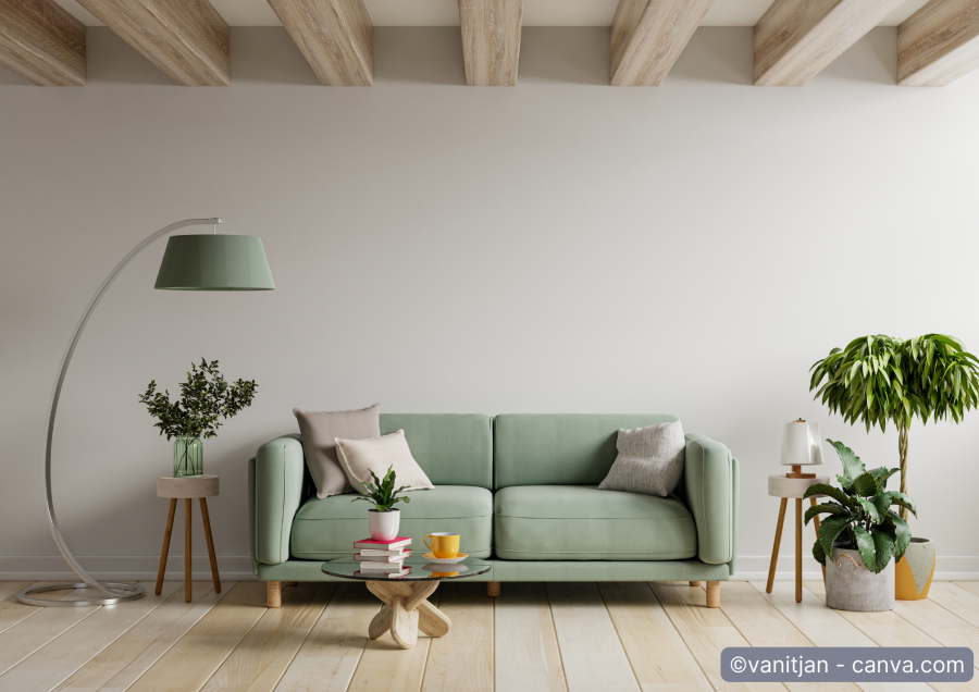 Modernes salbei-gruenes Sofa auf hellem Holzboden